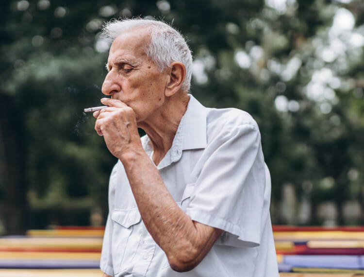 older gentleman smoking a cigar