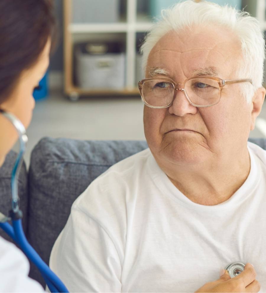 Man's chest examined, showcasing medical and legal assistance from mesothelioma firm.