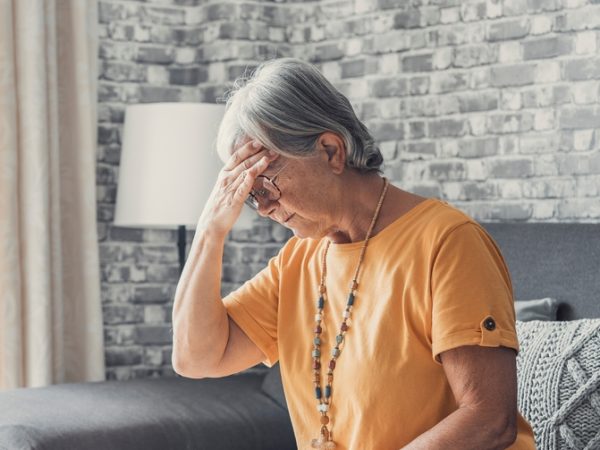Sad,Depressed,Middle,Aged,Mature,Woman,Sitting,Alone,At,Home
